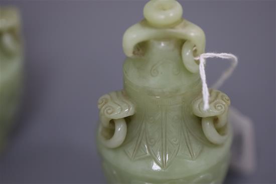 A pair of Chinese carved jade vases and covers, height 12cm